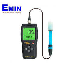 Technician performing calibration work on a pH measurement instrument