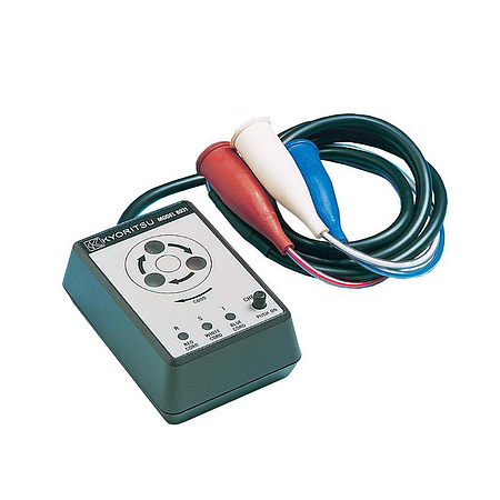 Technician handling an electrical phase indicator during calibration and inspection